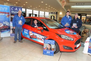 REPRO FREE 03/12/2015 Justin Young (Manager Mahon Point SC) behind the wheel of the Ford Fiesta which will be raffled this Christmas in aid of St. Vincent de Paul which is on display at Mahon Point Shopping Centre. Also included are Brendan O'Neill (SVP Chairman of the Fundraising Group), Seamus Harnedy (CAB Motors Ambassador) and Donal Whooley (SVP Northside Area President). Photo: Billy macGill