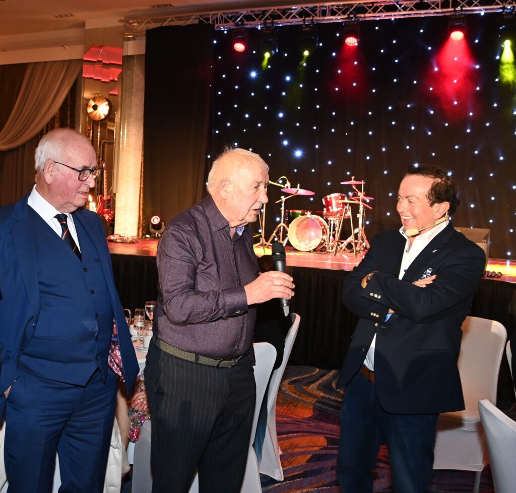 Pat Malone and Mick Malone speaking to Marty Morrissey at the Éire Óg GAA Club celebrations at the Rochestown Park Hotel.